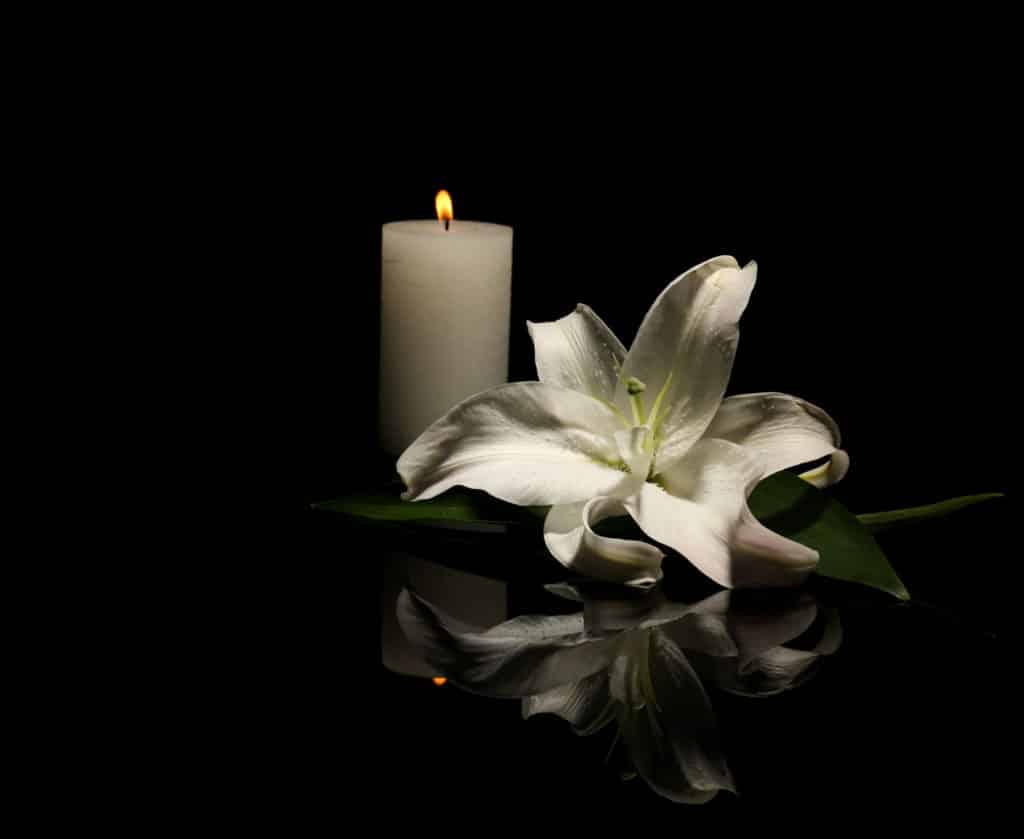 White Candle and flower for funeral